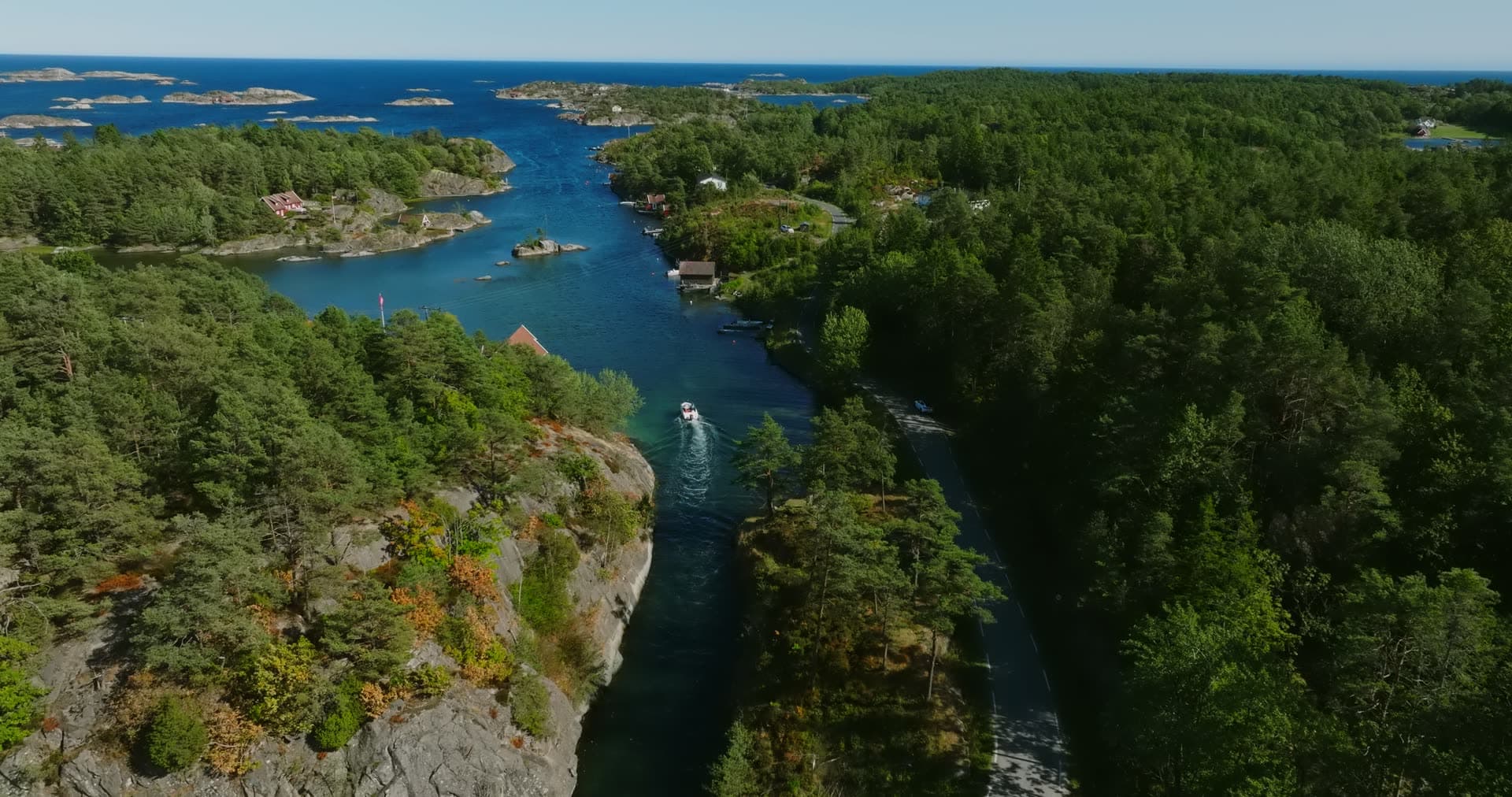 Sheer rock face above the boat channel, Lillesand, Norway