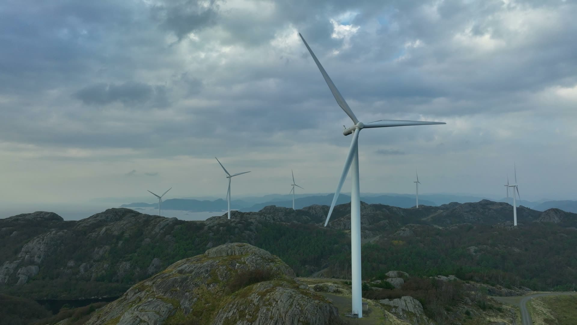 Wind turbines on bare rocky ridge, Lista, Norway