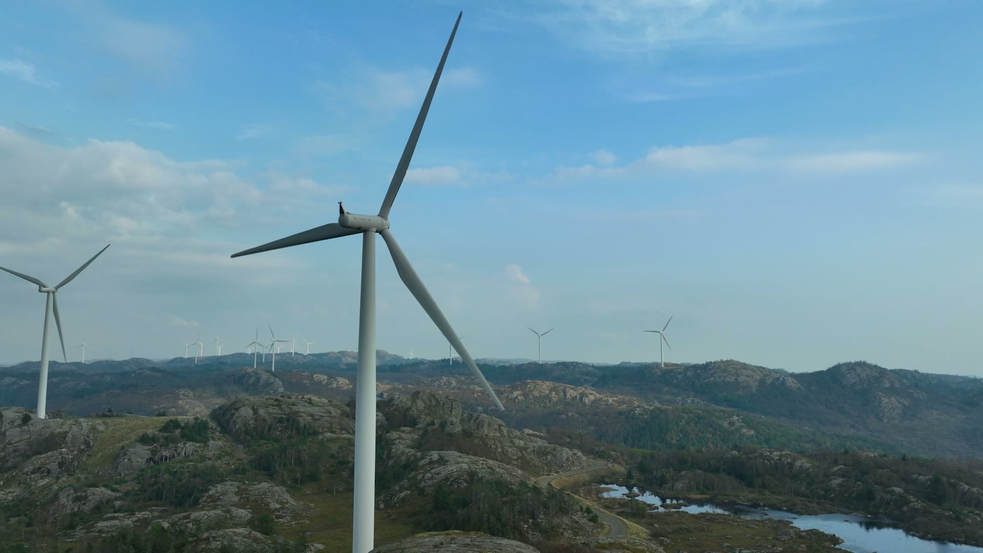 Wind turbines on bare rocky ridge, Lista, Norway