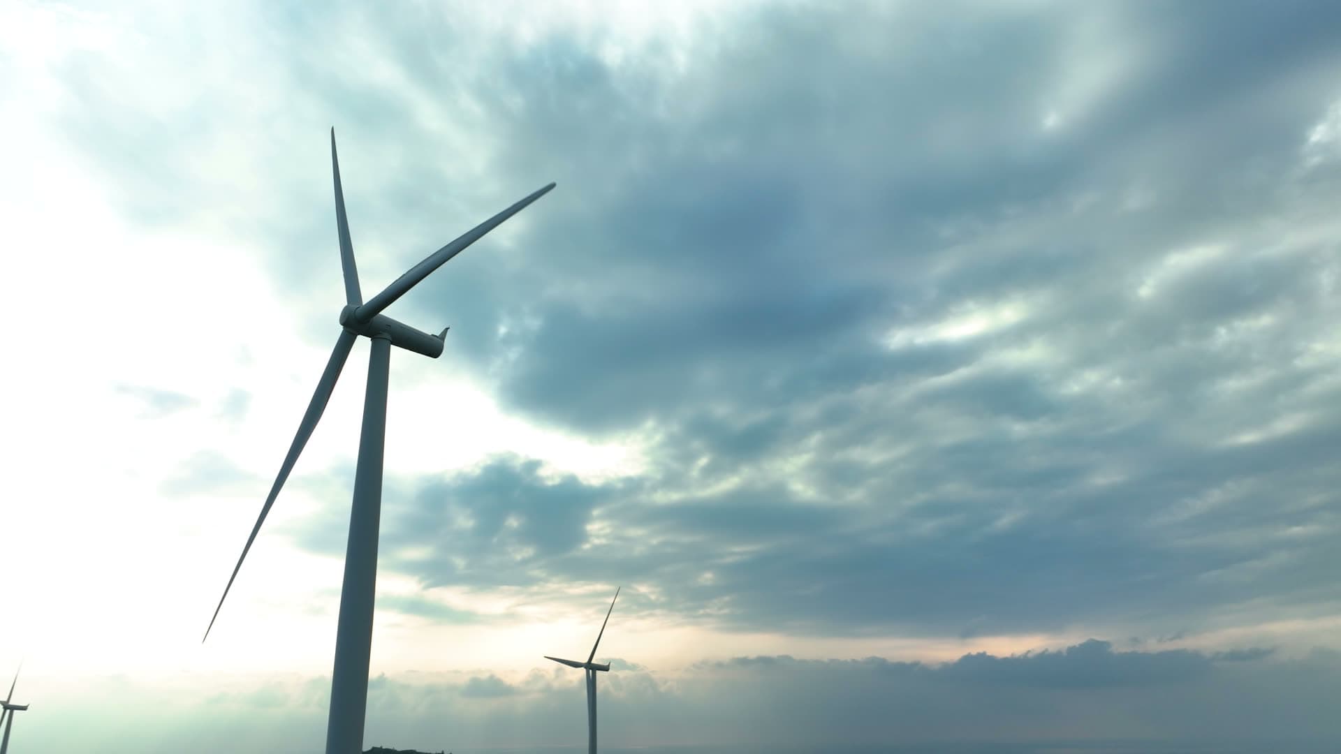 Wind turbine rotors against layered clouds, Lista, Norway