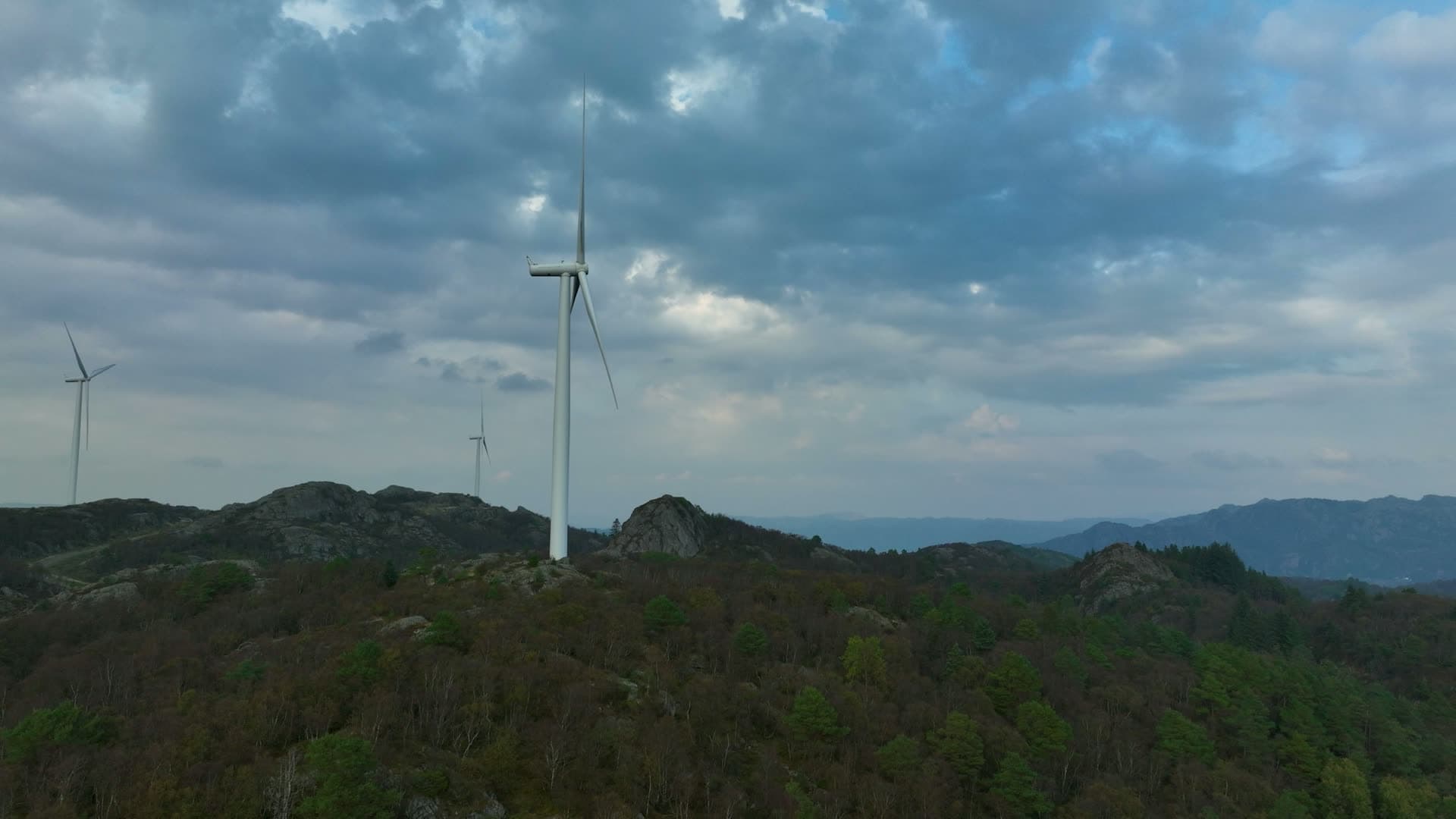 Wind turbines on rocky forested ridge, Lista, Norway