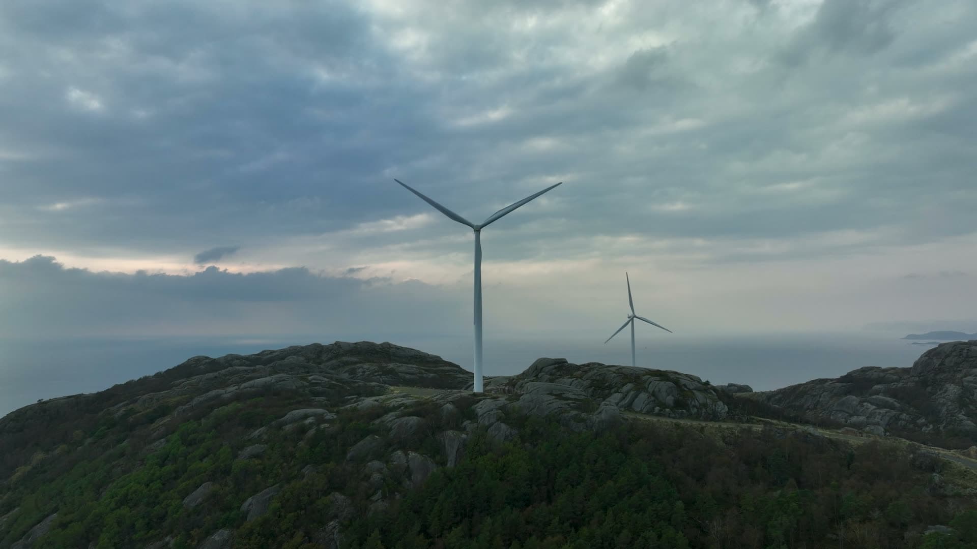 Two wind turbines on bare rock ridge, Lista, Norway