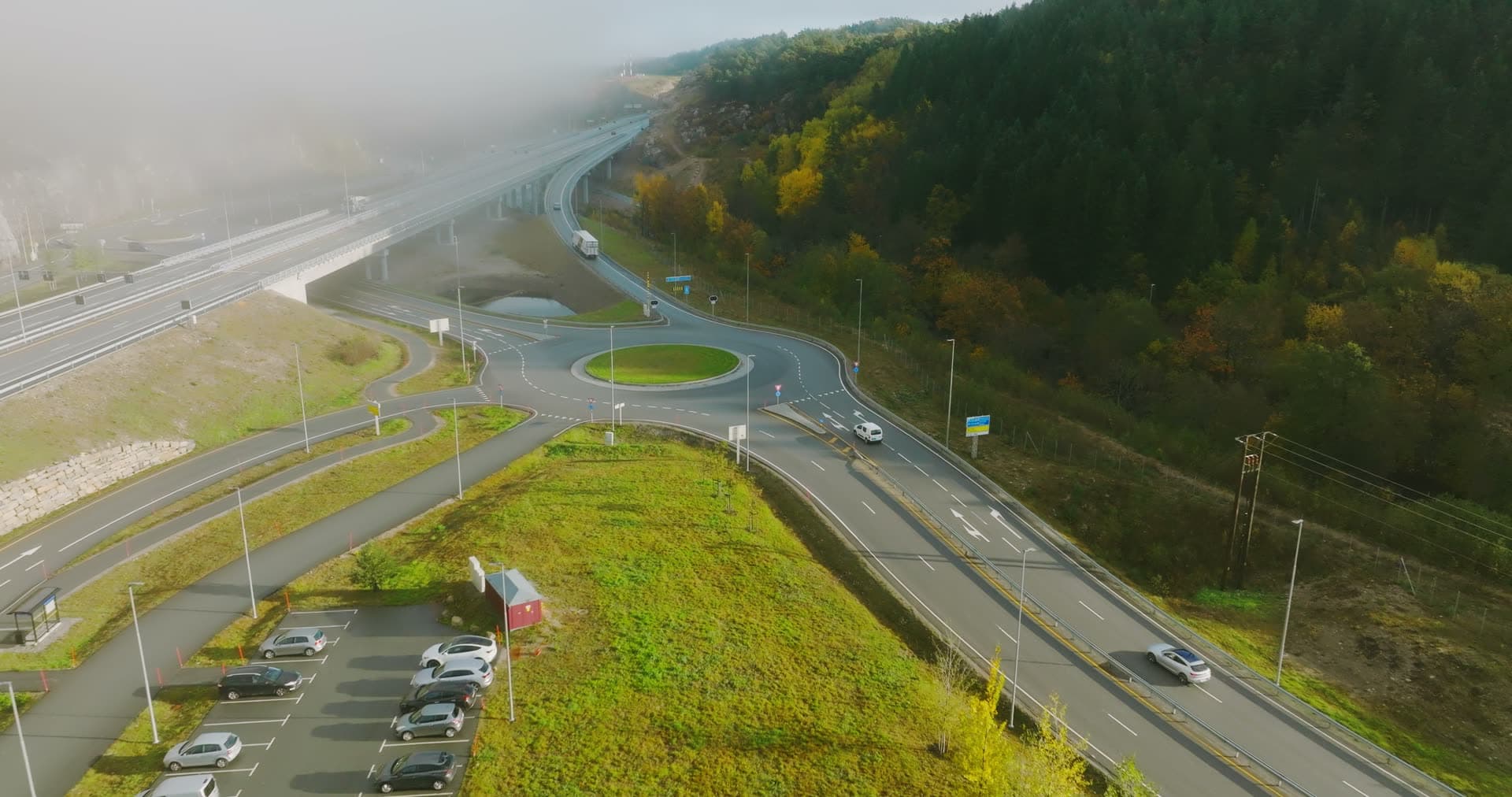 Fog over roundabout by highway bridge, Monan, Norway