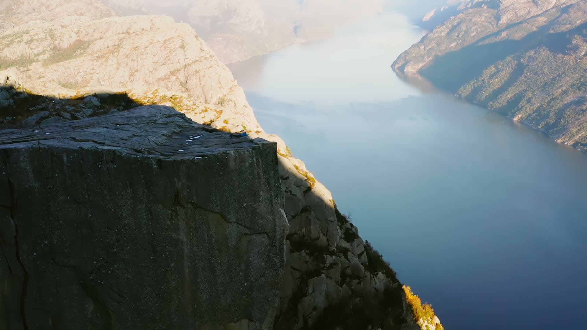 Empty flat cliff ledge above deep fjord, Preikestolen, Norway