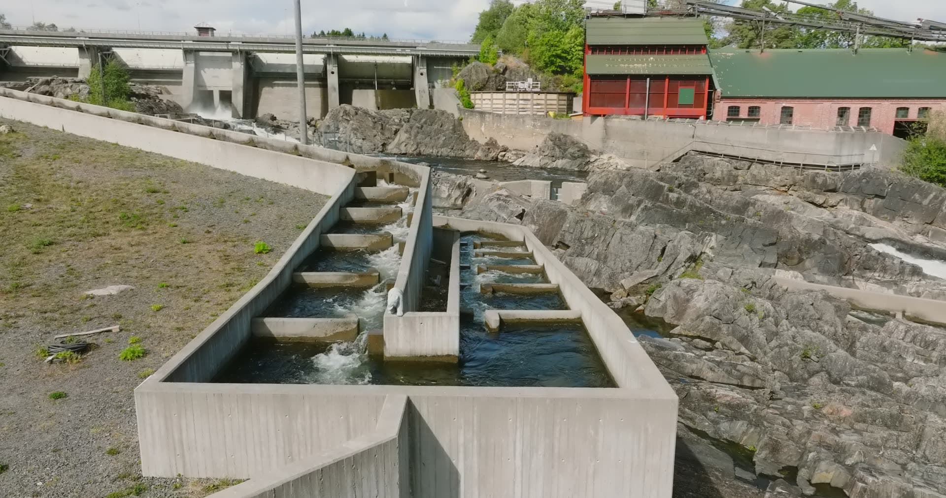 Concrete salmon ladder below dam gates, Rykene, Norway