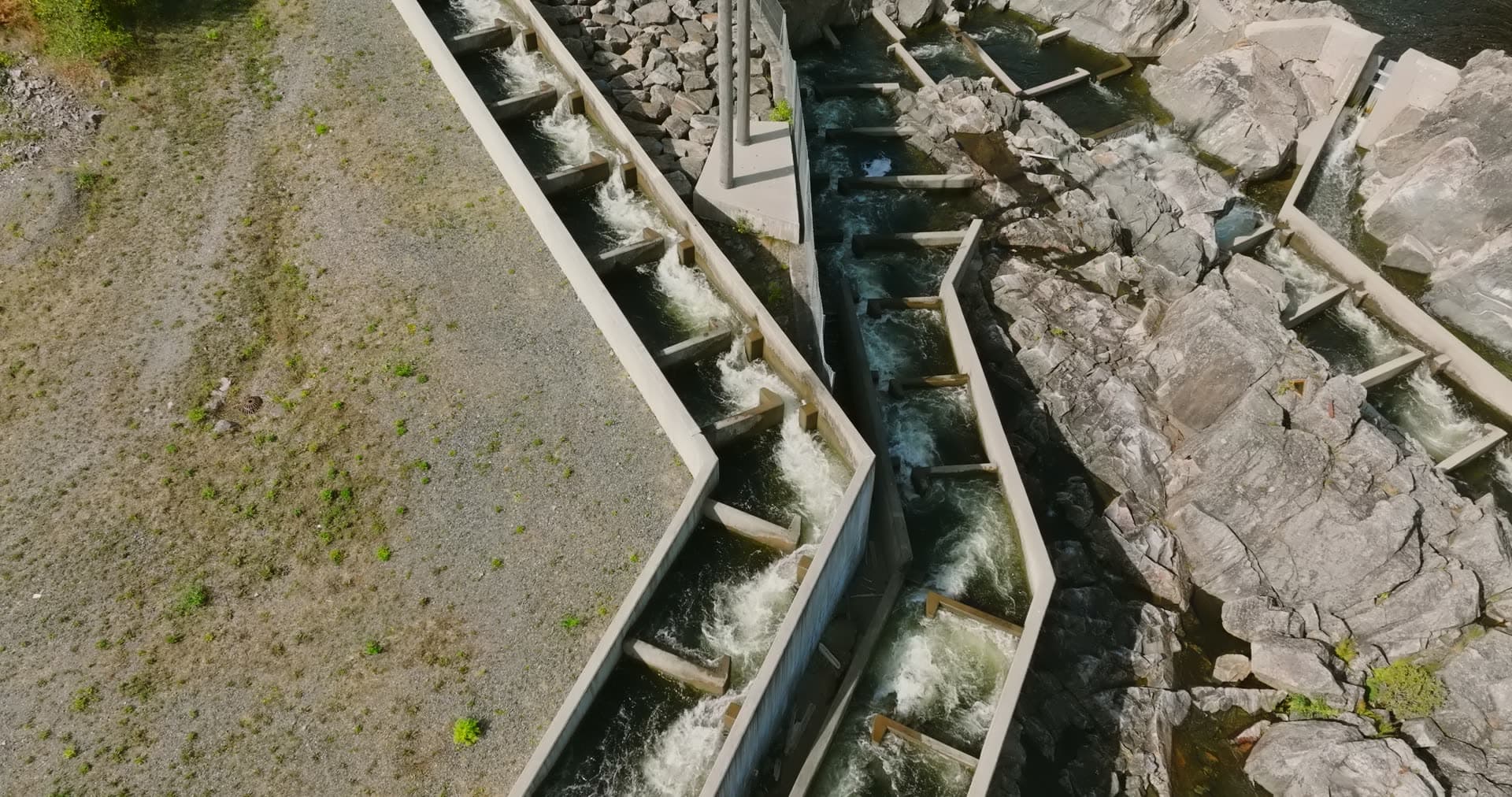 Water churning down zigzag fish pass channels, Rykene, Norway