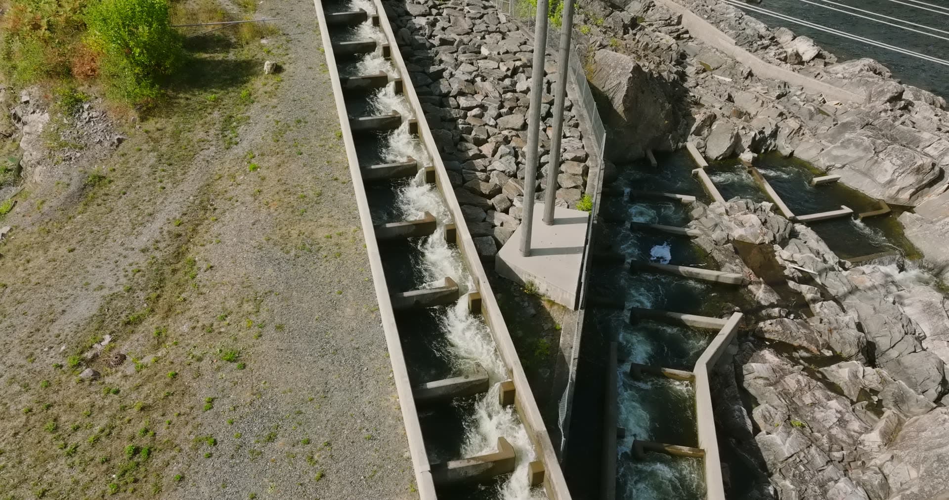 Concrete fish ladder steps beside rapids, Rykene, Norway