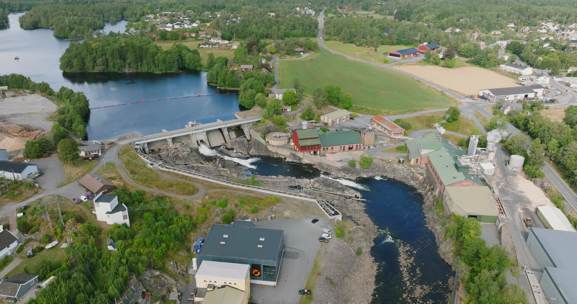 River dam and mill buildings below rapids, Rykene, Norway