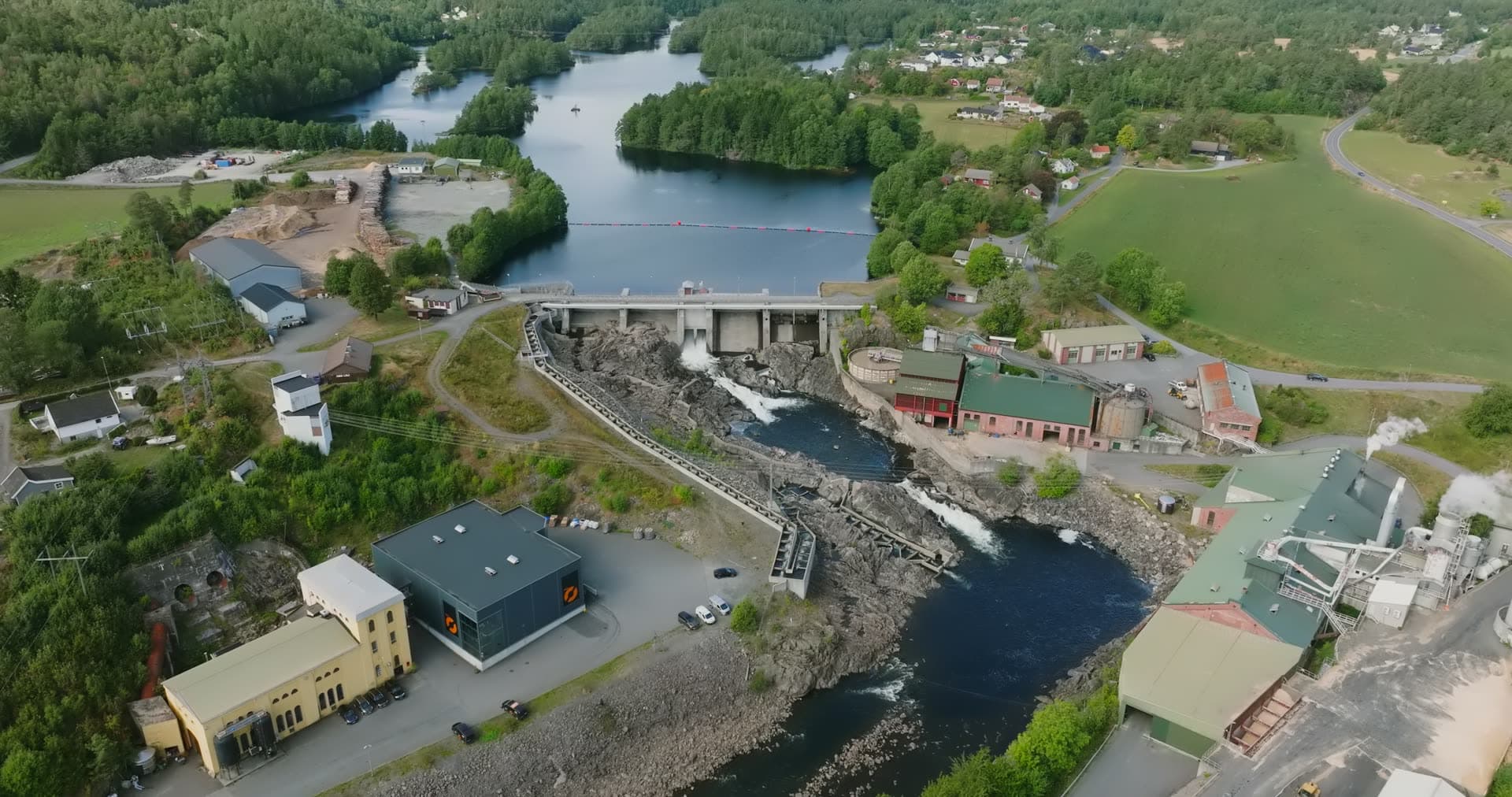 River dam and hydro plant below reservoir, Rykene, Norway