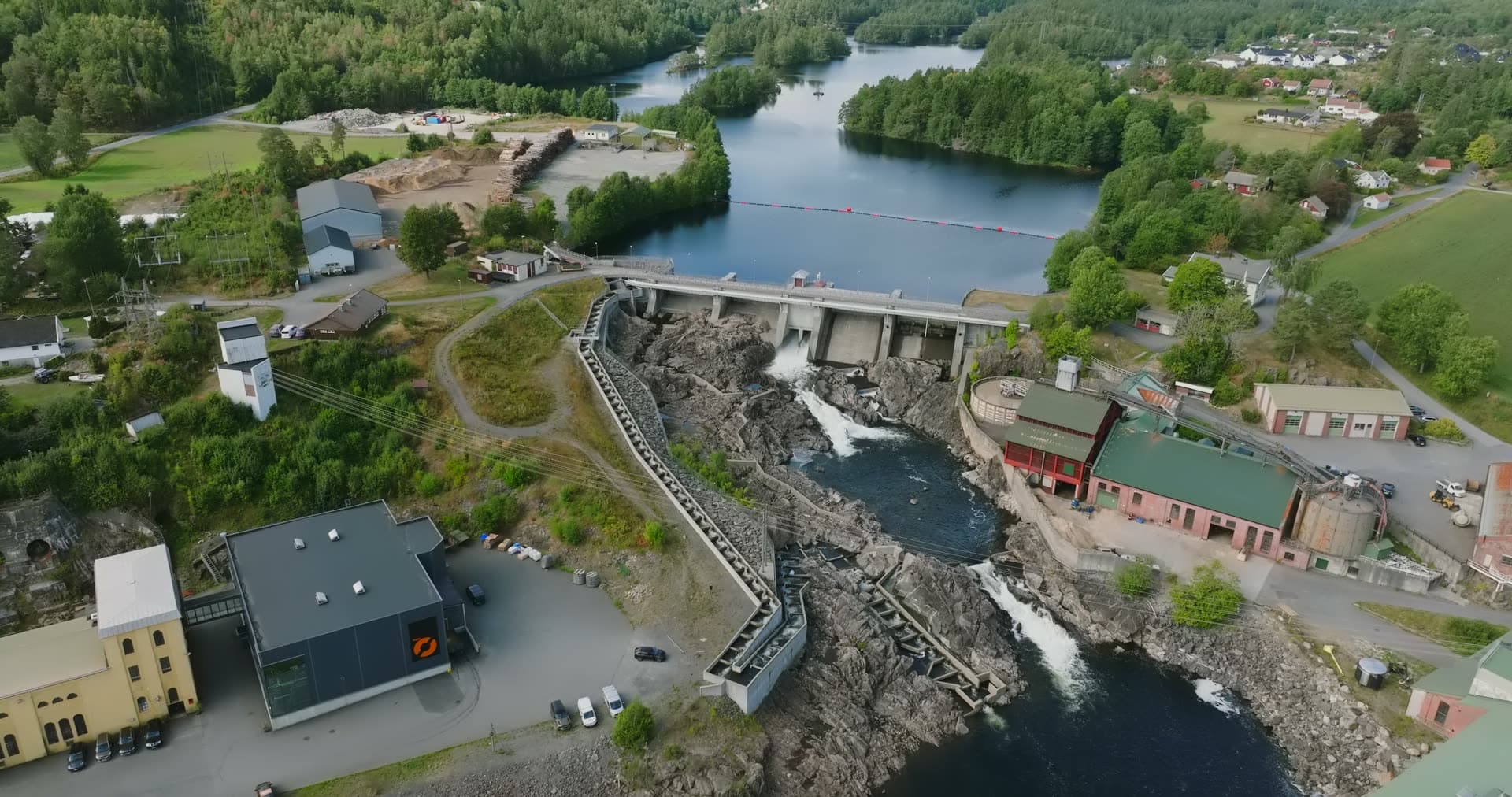 Dam with fish ladder and rapids below, Rykene, Norway