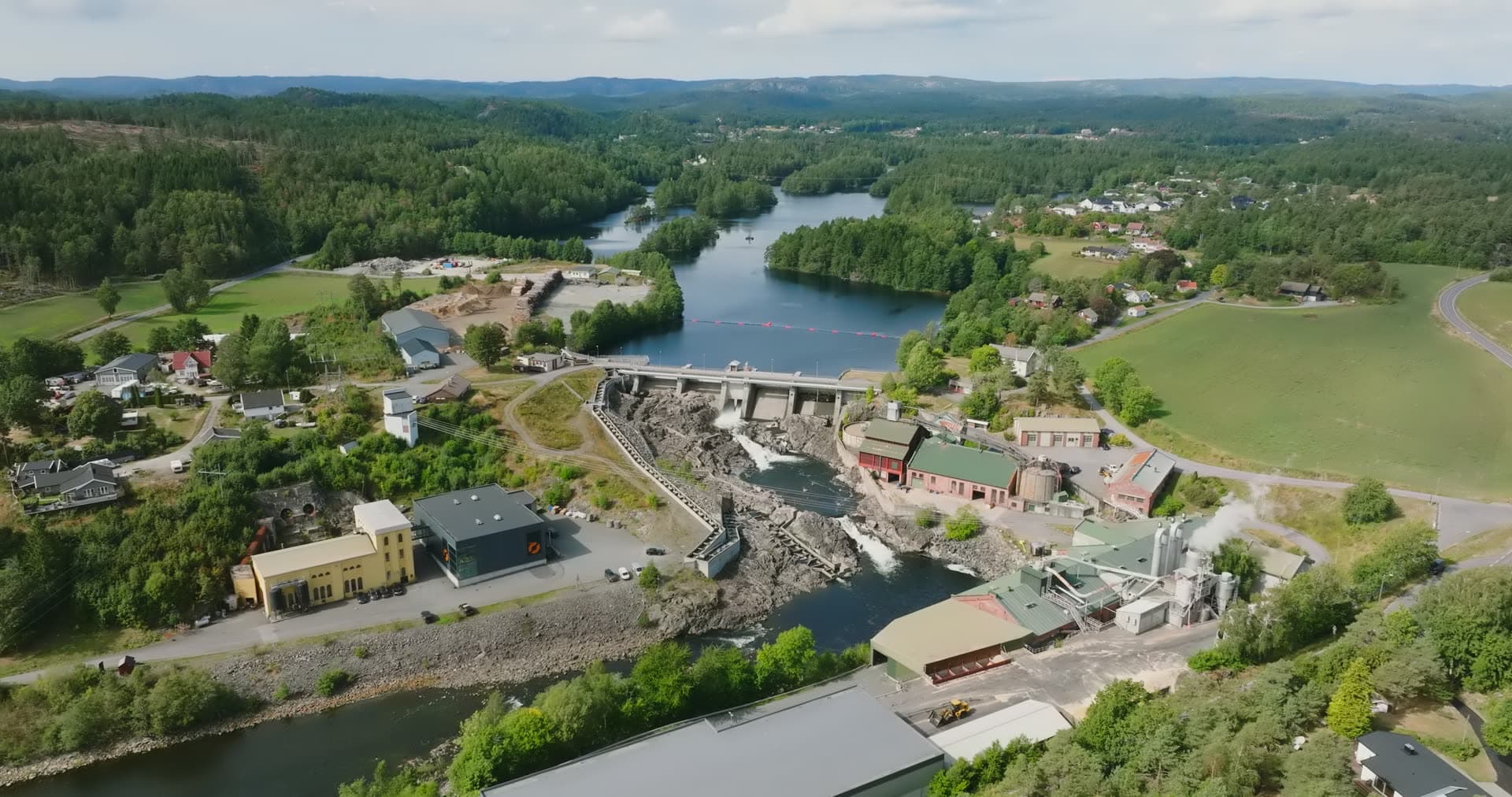 Hydro dam and rapids beside a mill village, Rykene, Norway