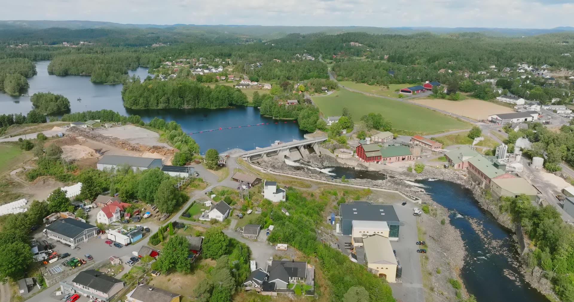 River dam and weir beside sawmill town, Rykene, Norway
