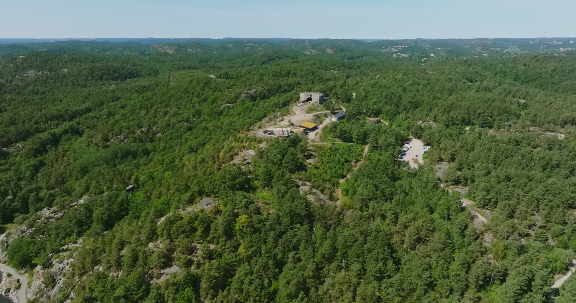 Concrete coastal fort on a wooded ridge, Møvik, Norway