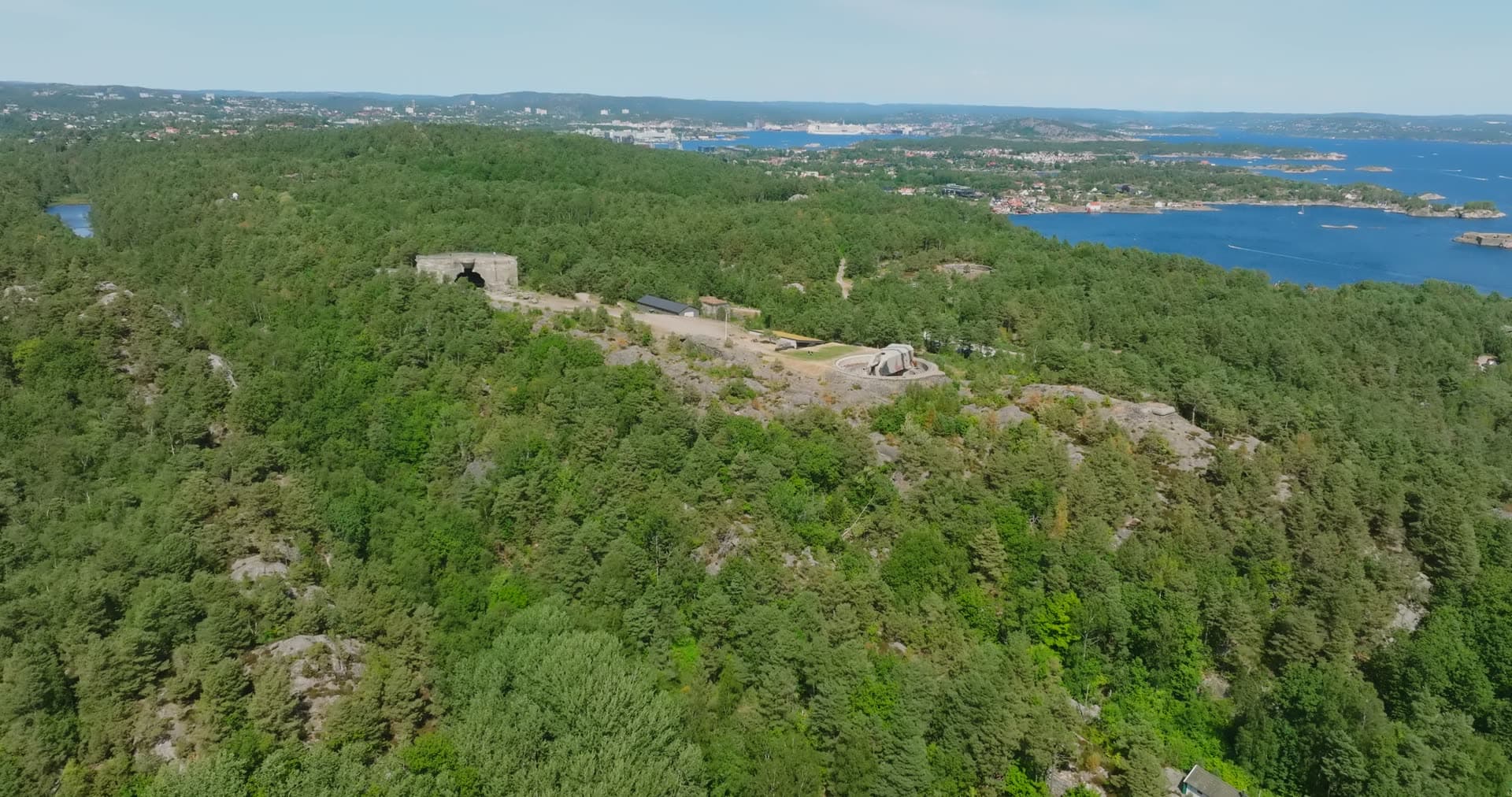 Wooded ridge with the old battery over the strait, Møvik, Norway