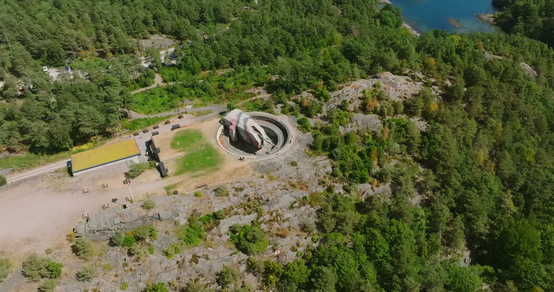 Gun turret and green-roofed hall above the fjord, Møvik, Norway