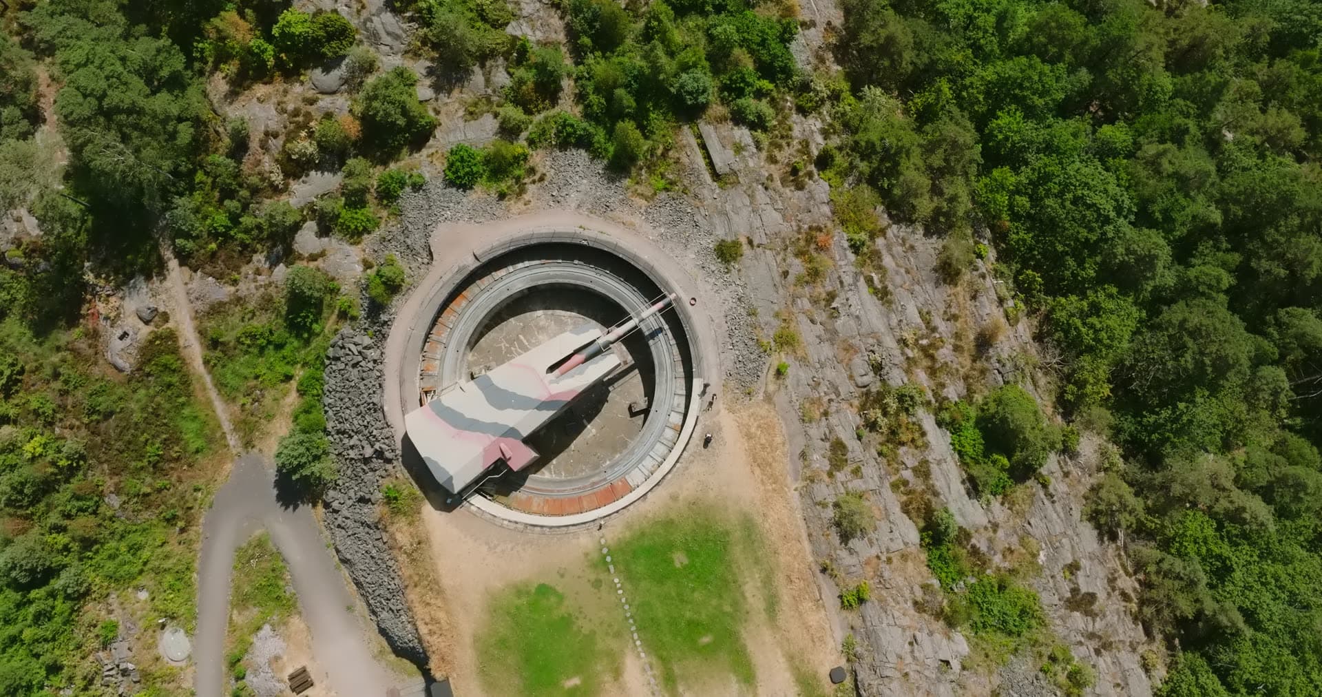 Gun turret ringed by bare rock and pine, Møvik, Norway