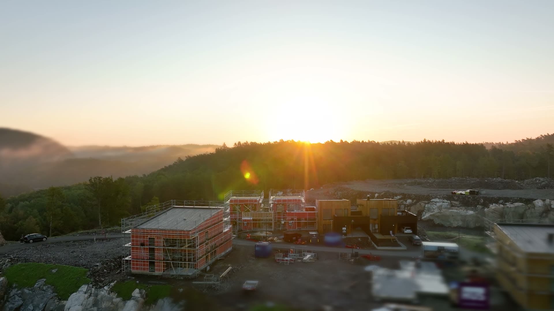 Housing site with scaffolding at sunrise, Søm, Norway