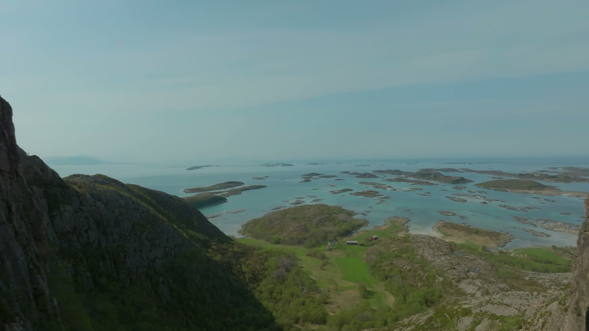Hiker in rock tunnel above skerries, Torghatten, Norway