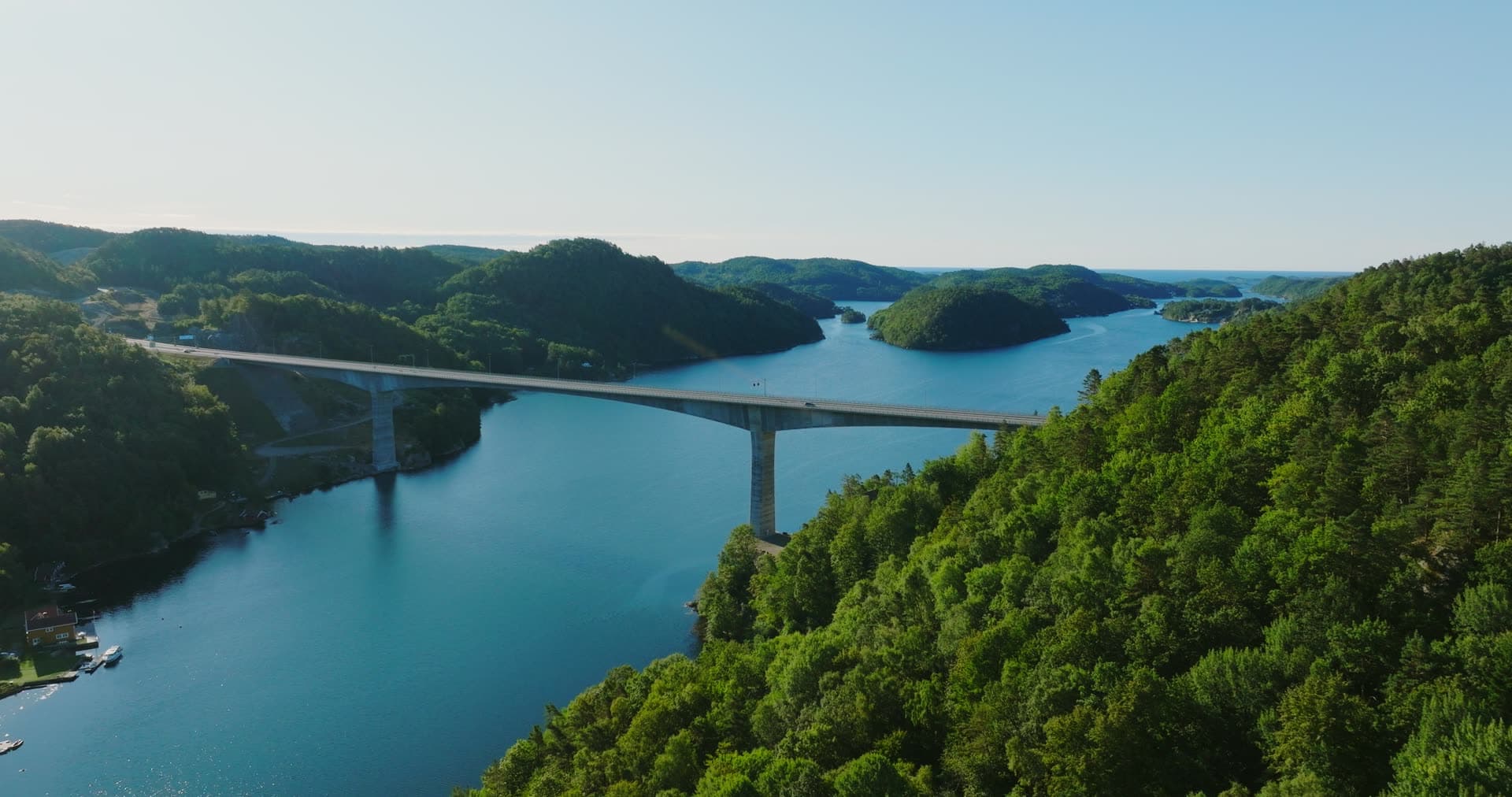 High concrete bridge over forested fjord, Trysfjordbrua, Norway