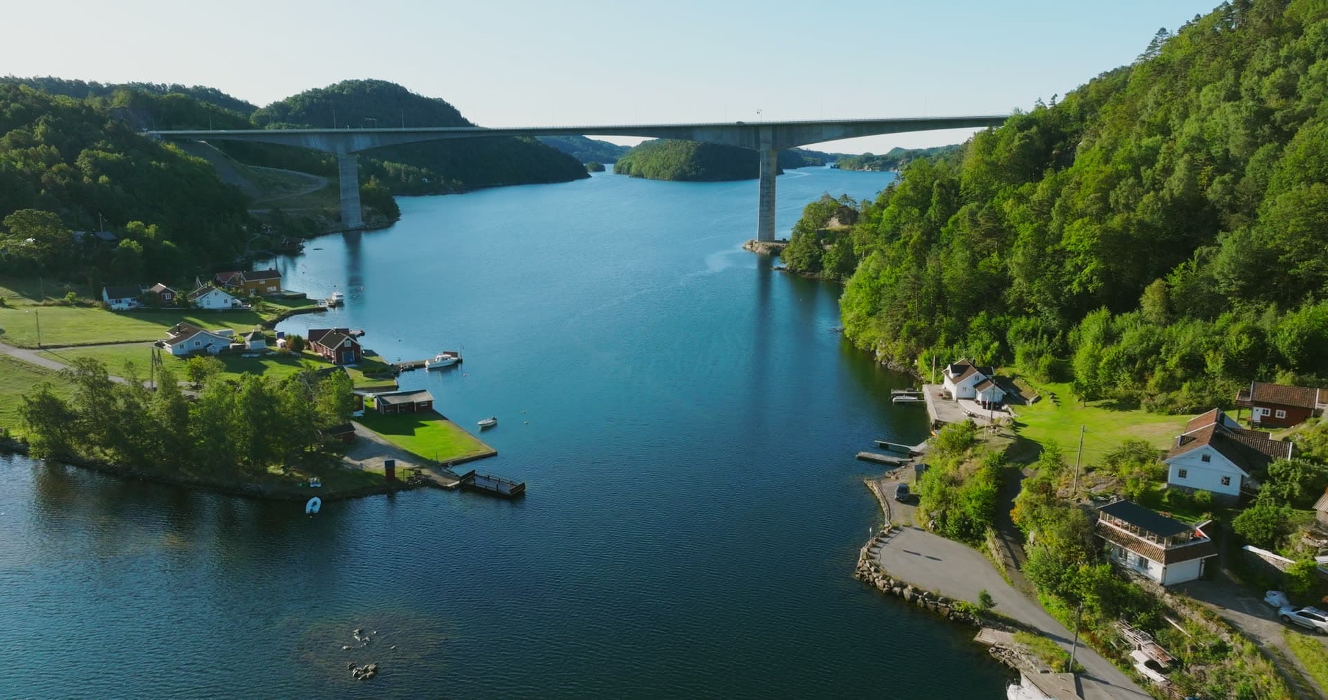 High bridge over fjord between boat docks, Trysfjordbrua, Norway