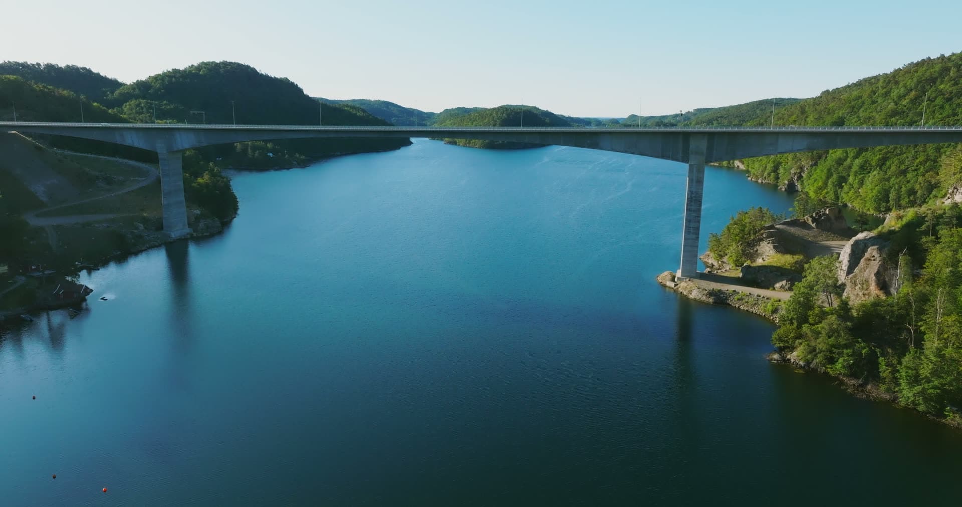 Moored white boat under bridge span, Trysfjordbrua, Norway