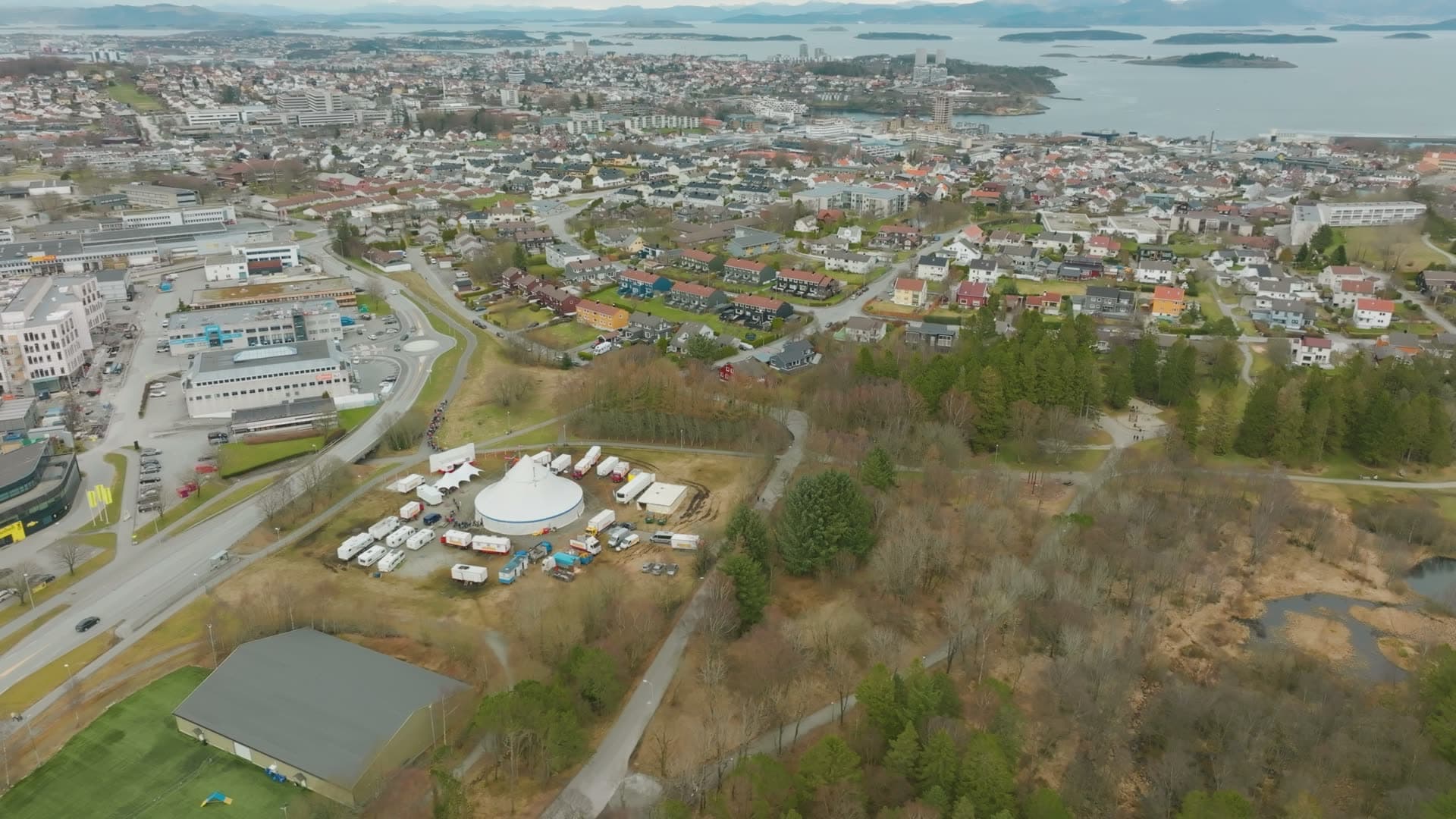 Circus tent and trailers by city parkland, Vannassen, Norway