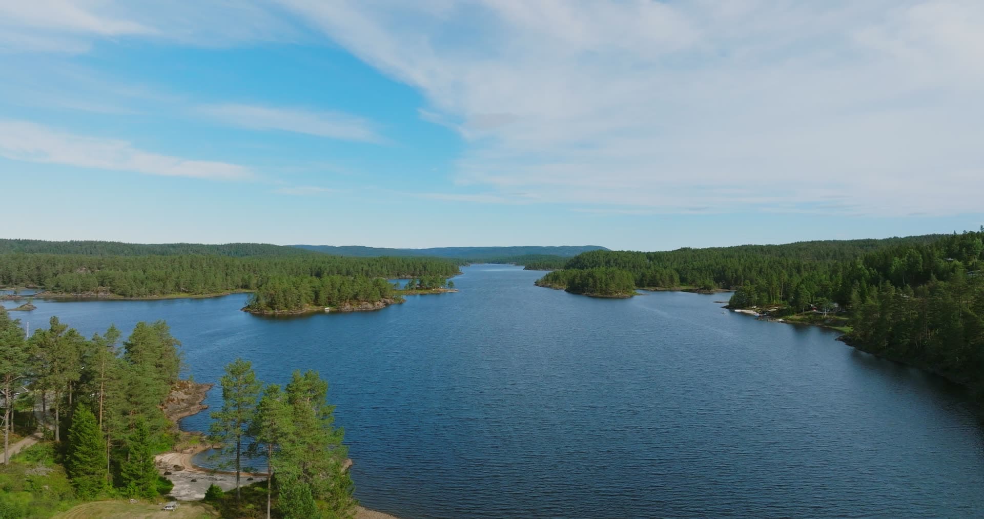 Pine-covered points narrowing a lake, Vassbotn, Norway