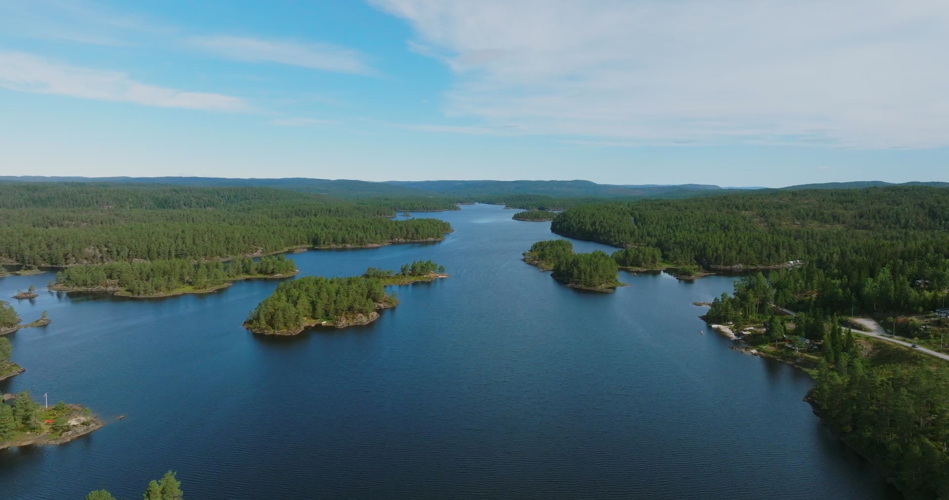 Lake channel splitting around wooded spits, Vassbotn, Norway
