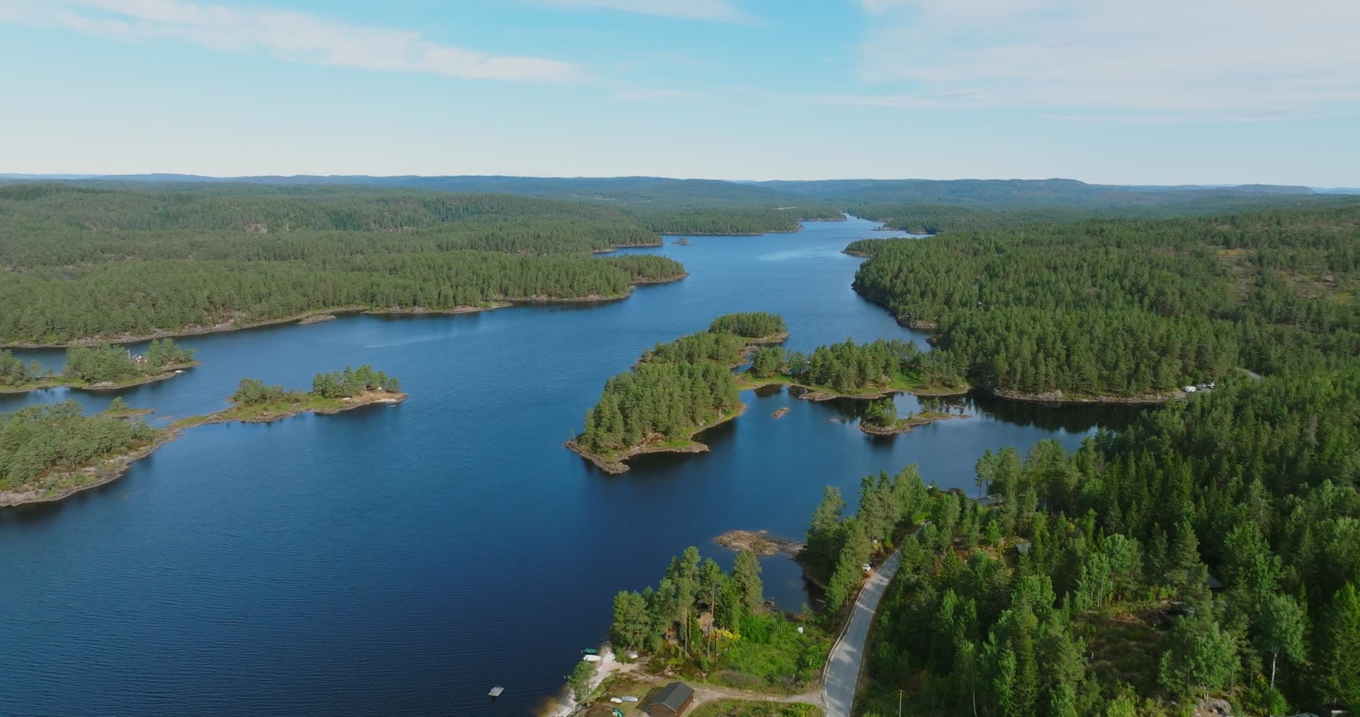 Pine islets in lake beside cabin road, Vassbotn, Norway