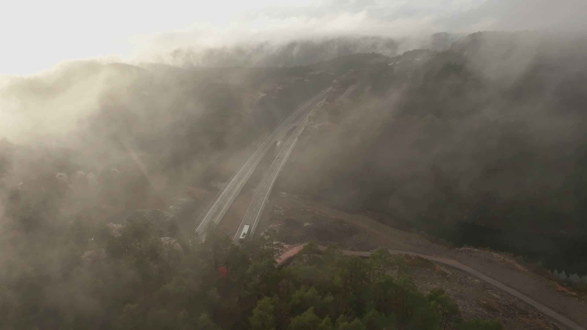 Descent through fog to new highway bridge, Vedderheia, Norway