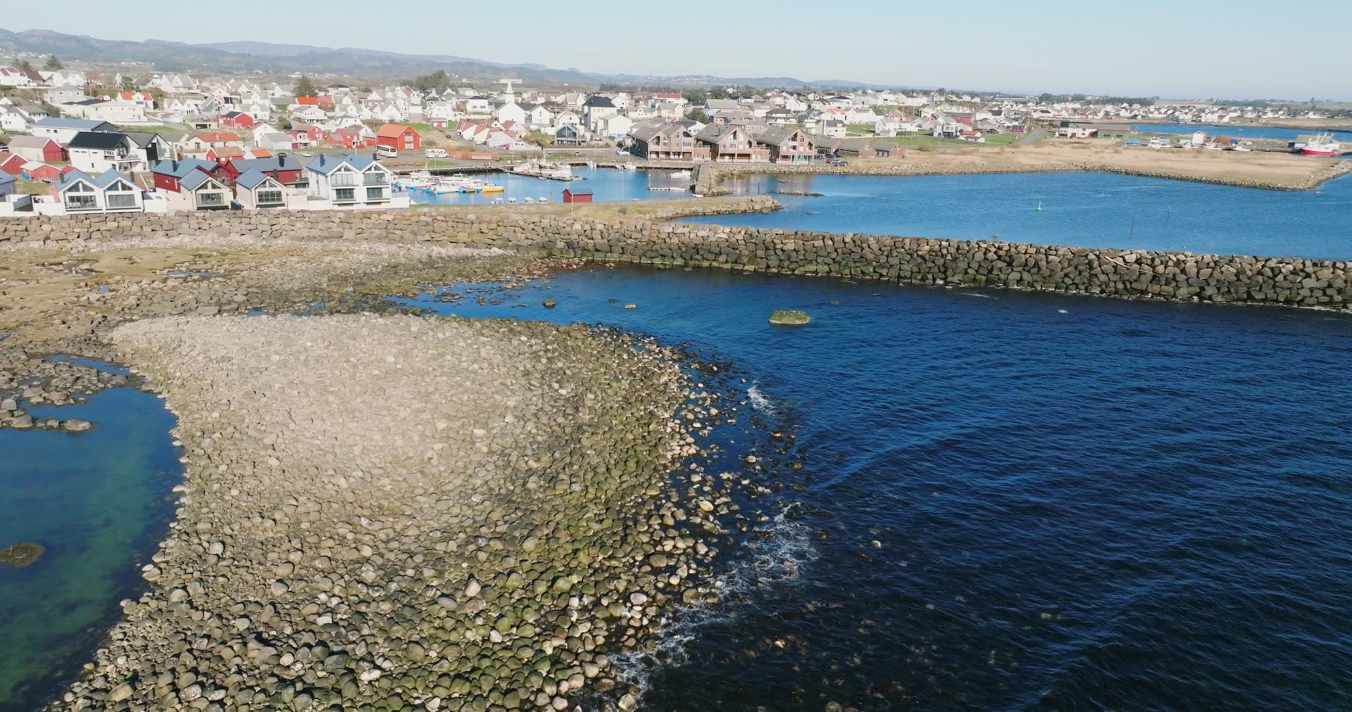 Boulder breakwater sheltering harbour, Vestbygd, Norway